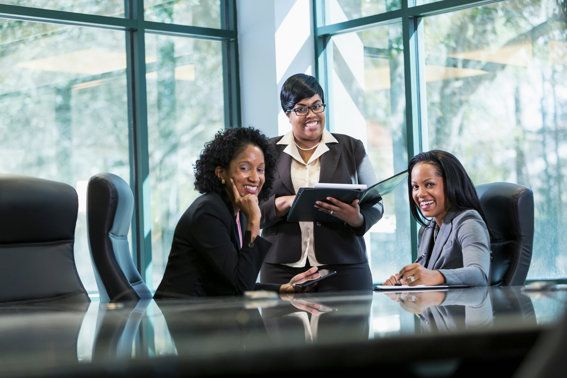 Three black women in business meeting